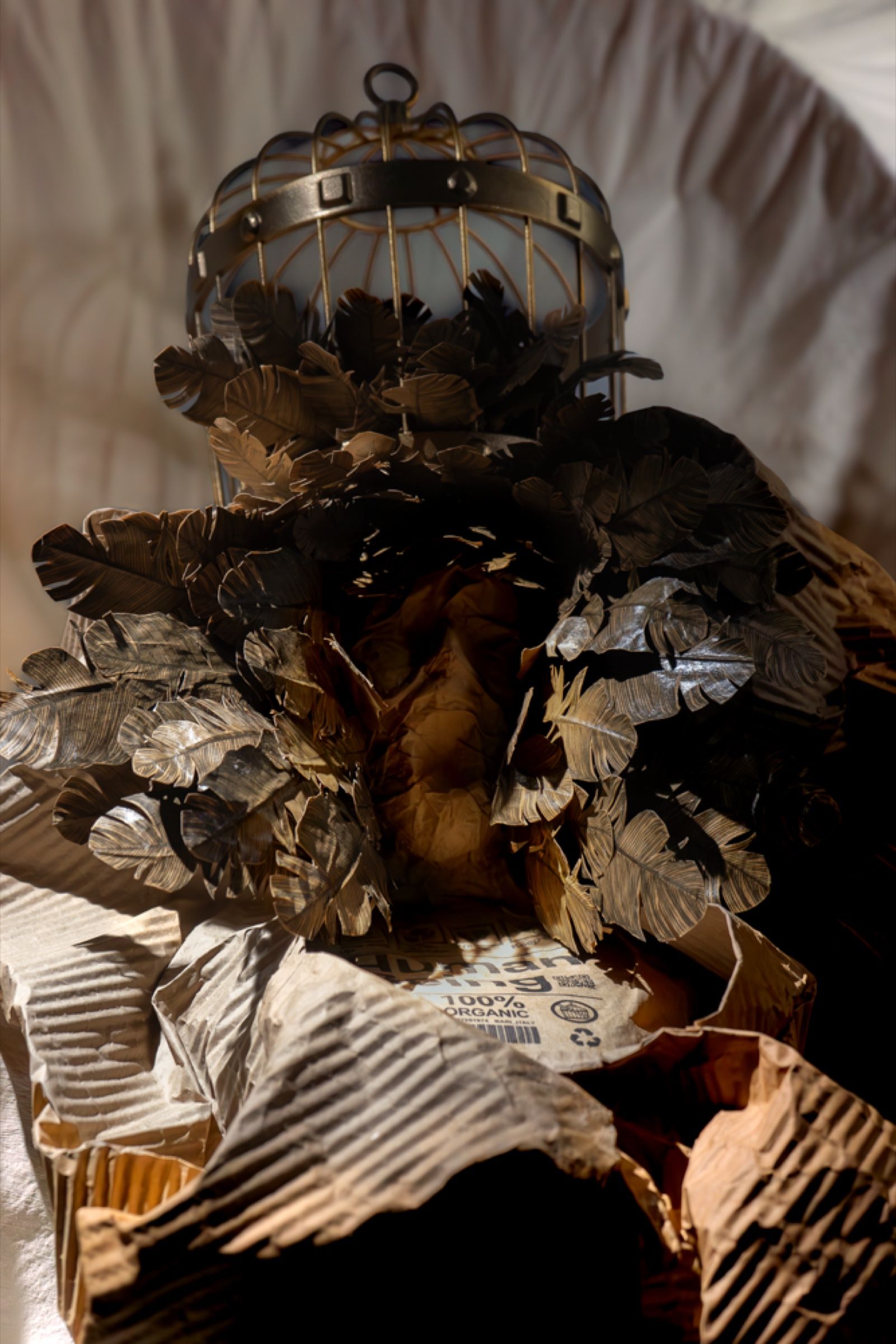 Detail of the Madonna’s head, with the golden cage resting on a crown of paper feathers.